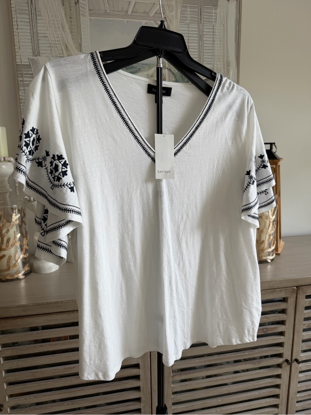 Karen Kane White V-Neck Top with Navy Embroidered Flutter Sleeves